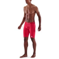 SKINS 1-Series Half Tights - Rood -Sportwinkel skins compression 1 series men half tights red 4 941230